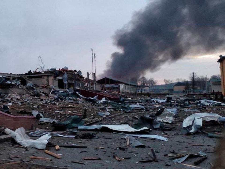 Smoke rises amid damaged buildings following an attack on the Yavoriv military base (@BackAndAlive via REUTERS)