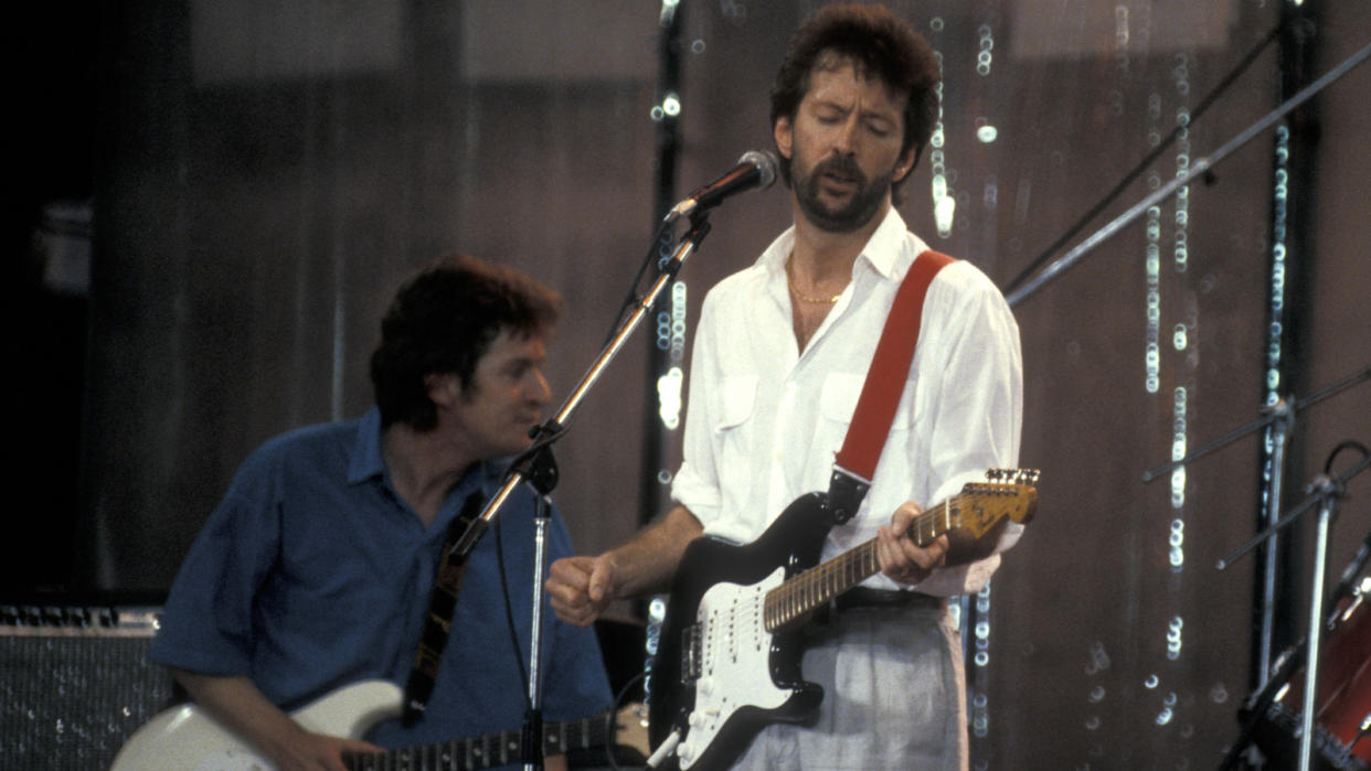  Eric Clapton performs at the "Live Aid Concert" on July 13, 1985 at JFK Stadium in Philadelphia, Pennsylvania.  