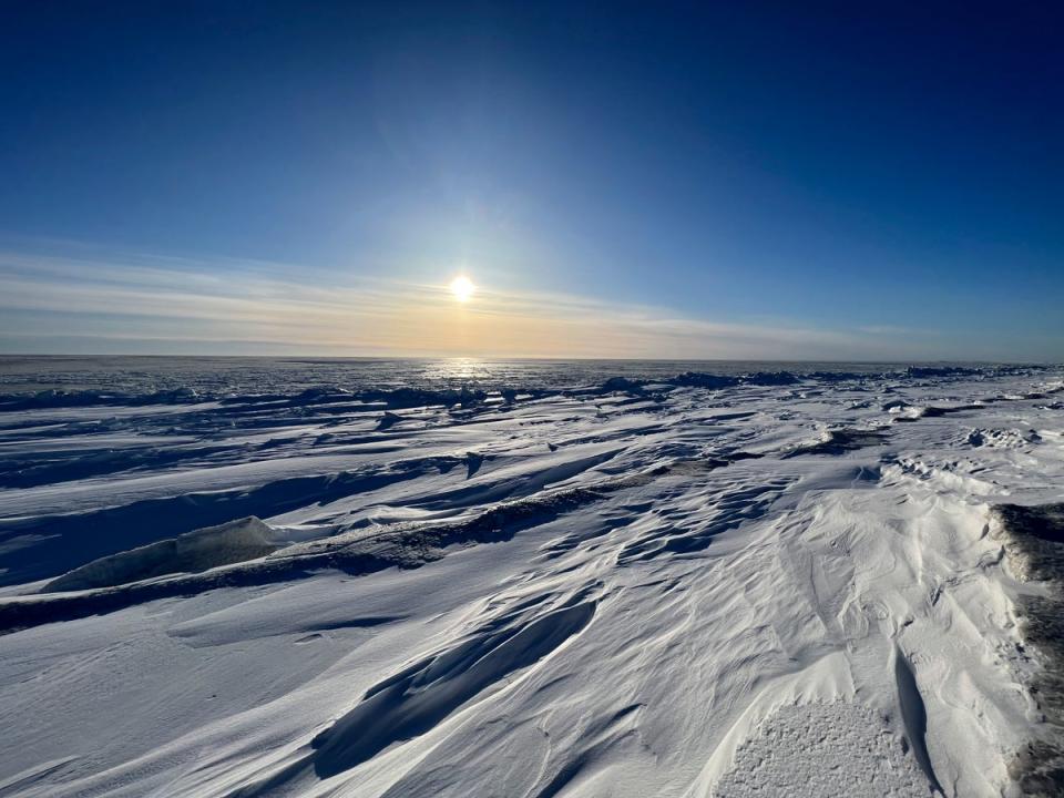 The sun sets outside of the northwest Alaska village of Point Hope on the Chukchi Sea, 21 February 2024 (AP)