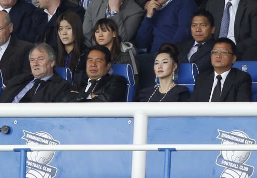 File photo of Birmingham City owner Carson Yeung (2nd L) watches the team play at St. Andrews in Birmingham. Yeung took control of Birmingham City in October 2009 in an £81 million ($130 million) takeover from David Sullivan and David Gold, now the co-owners of West Ham