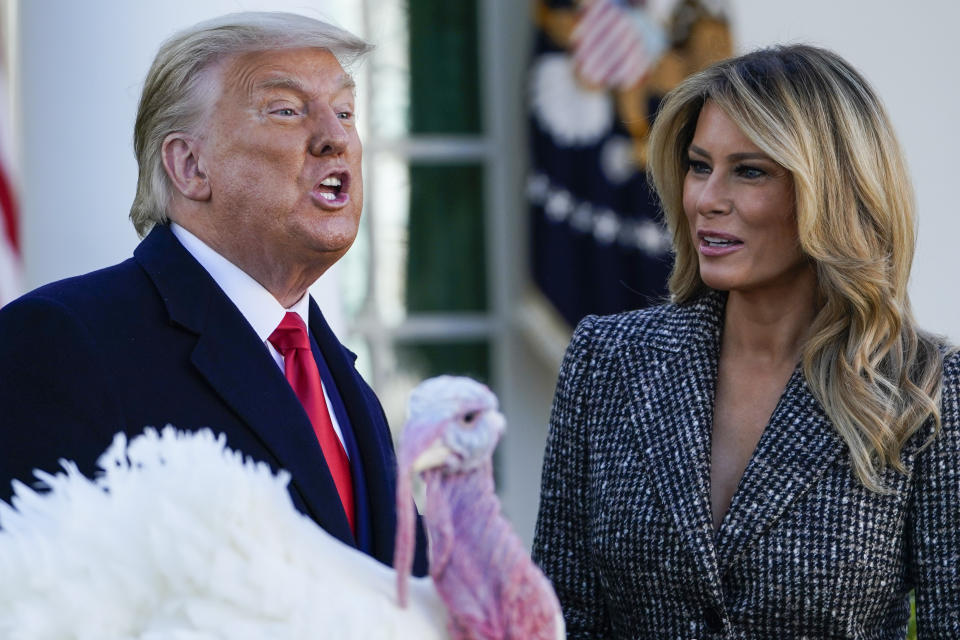 President Donald Trump speaks after pardoning Corn, the national Thanksgiving turkey, in the Rose Garden of the White House, Tuesday, Nov. 24, 2020, in Washington, as first lady Melania Trump watches. (AP Photo/Susan Walsh)