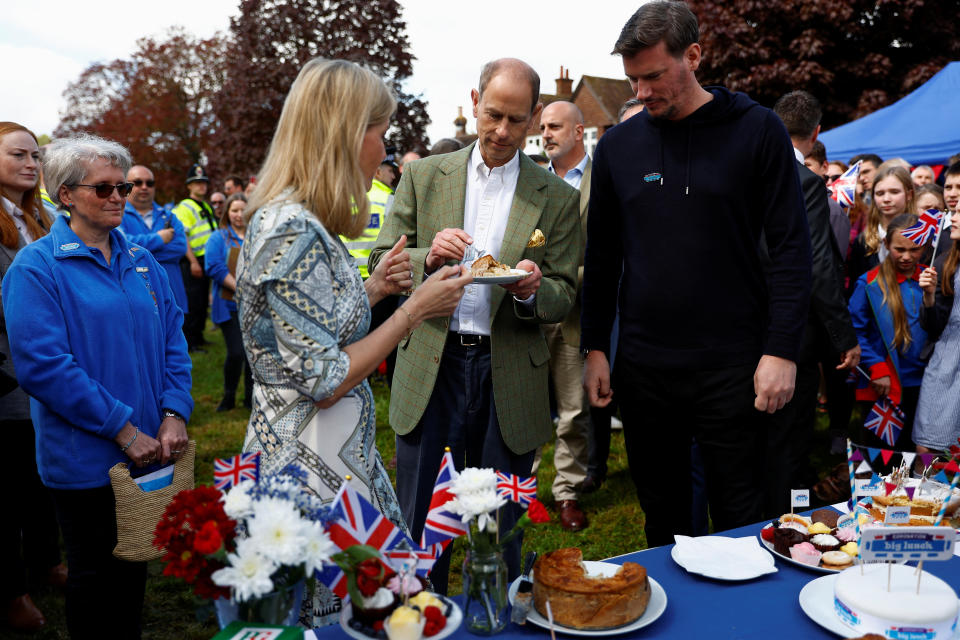 CRANLEIGH, ENGLAND - MAY 07: Britain's Prince Edward, Duke of Edinburgh and Sophie, Duchess of Edinburgh taste a coronation chicken pie as they attend a Big Lunch with residents and representatives from the Royal British Legion, the Scouts and the Guides, in Cranleigh Village Hall, Cranleigh village on May 7, 2023 in Cranleigh, England. (Photo by Peter Nicholls-WPA Pool/Getty Images)