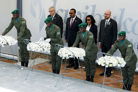 Belgium's Prime Minister Charles Michel, Ethiopia's Prime Minister Abiy Ahmed and European Commission President Jean-Claude Juncker attend a wreath laying ceremony during the commemoration of the 25th anniversary of the Rwandan genocide at the Genocide Memorial in Gisozi in Kigali, Rwanda. April 7, 2019.REUTERS/Baz Ratner