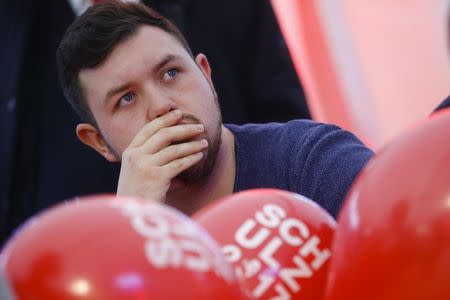 A supporter of Social Democratic Party (SPD) reacts on first exit polls after the federal election at the party headquarters in Berlin, Germany, September 24, 2017. REUTERS/Hannibal Hanschke