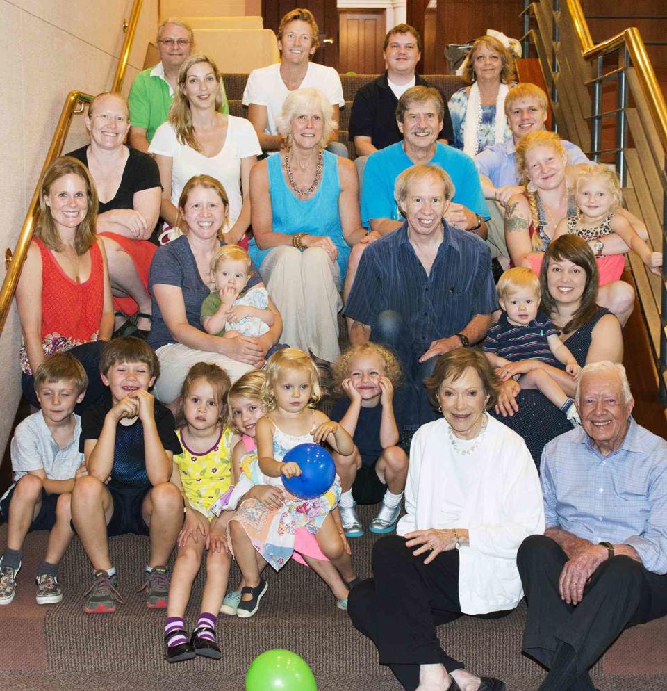 <p>Four generations! Jimmy and Rosalynn pose with their three children, their spouses, some of their grandchildren and great-grandchildren at The Carter Center in Atlanta in 2014.</p> <p>"They're just very active citizens in this 600-person town," grandson Jason told <a href="https://people.com/politics/jimmy-carter-legacy-reexamined-in-new-documentary/" rel="nofollow noopener" target="_blank" data-ylk="slk:PEOPLE;elm:context_link;itc:0;sec:content-canvas" class="link ">PEOPLE</a> in 2021 of the former first couple's busy retirement. "[They're] trying to help people fix their roofs, make sure the town is healthy and happy and has a Boys and Girls Club that people can go to and get support and things like that."</p>