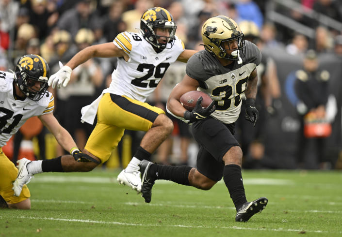 Purdue running back Dylan Downing (38) runs the ball during the second half of an NCAA college football game against Iowa, Saturday, Nov. 5, 2022, in West Lafayette, Ind. (AP Photo/Marc Lebryk)