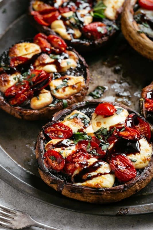 <p>Cafe Delites</p><p>Garlic butter smothered portobello mushrooms are stuffed with fresh mozzarella cheese and grape tomato slices. Drizzle with a rich balsamic glaze for the best stuffed mushrooms recipe!</p><p><strong>Get the recipe: <a href="https://cafedelites.com/caprese-stuffed-garlic-butter-portobellos/" rel="nofollow noopener" target="_blank" data-ylk="slk:Caprese Stuffed Garlic Butter Portobellos;elm:context_link;itc:0;sec:content-canvas" class="link ">Caprese Stuffed Garlic Butter Portobellos</a></strong></p>