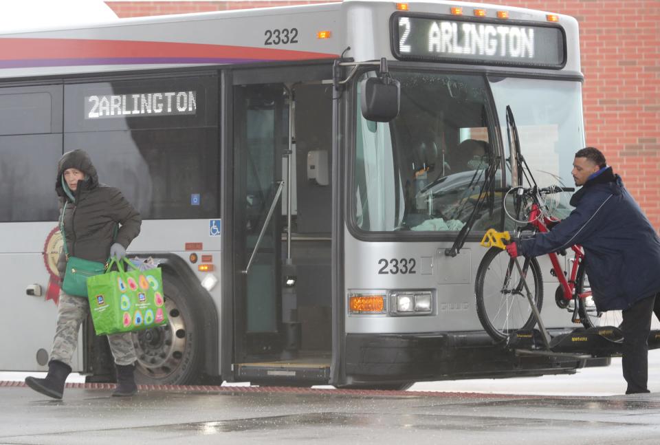 Passengers arrive at the Robert K. Pfaff Transit Center on South Broadway in Akron on Friday.