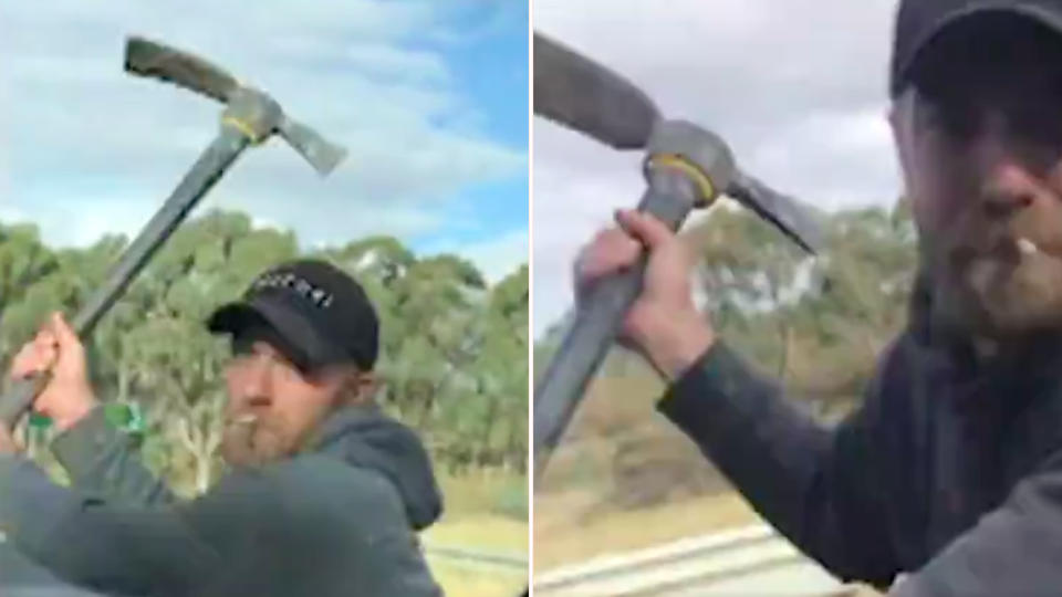 A terrified woman filmed as a man wielding pickaxe attacked her car. Source: 7 News