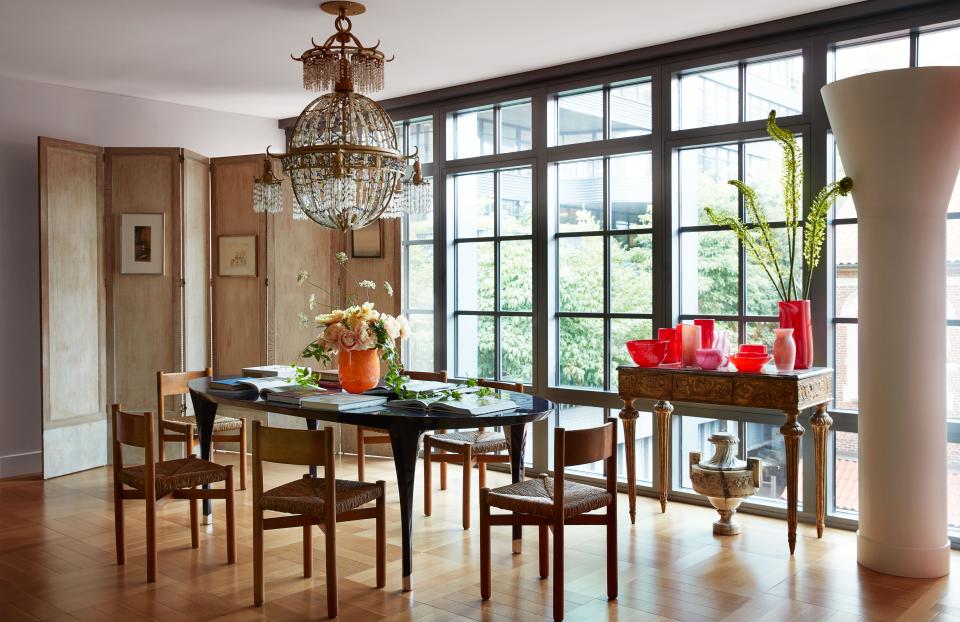 In the dining area, a Baguès chandelier once owned by Yves Saint Laurent and 1950s Charlotte Perriand chairs.