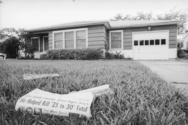 A newspaper on he lawn of Dean Corll's home.