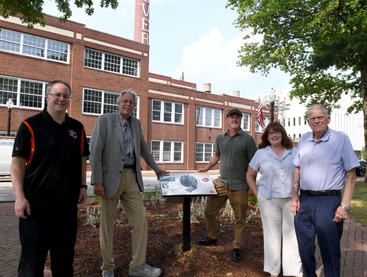 History enthusiast Doug Wechter, third from right, stands next to a new panel about the origins of the Hoover Co. in North Canton's Bitzer Park with members of an ad hoc committee that vetted his ideas for Phase 2 of the North Canton Hoover Trail,. Committee members, left to right, are North Canton Council President Matthew Stroia, At-Large; Doug Lane, a field representative for U.S. Rep. Emilia Sykes, D-Akron; Megan Pellegrino, director of the Hoover Historical Center; and Dave McDaniel, former president of the North Canton Heritage Society.