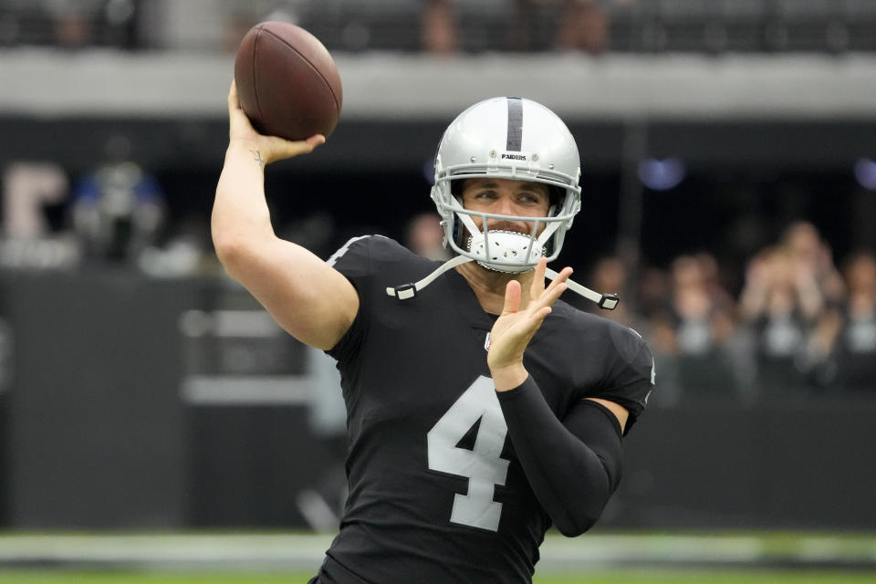 Las Vegas Raiders quarterback Derek Carr warms up before an NFL preseason football game, Sunday, Aug. 14, 2022, in Las Vegas. (AP Photo/Rick Scuteri)