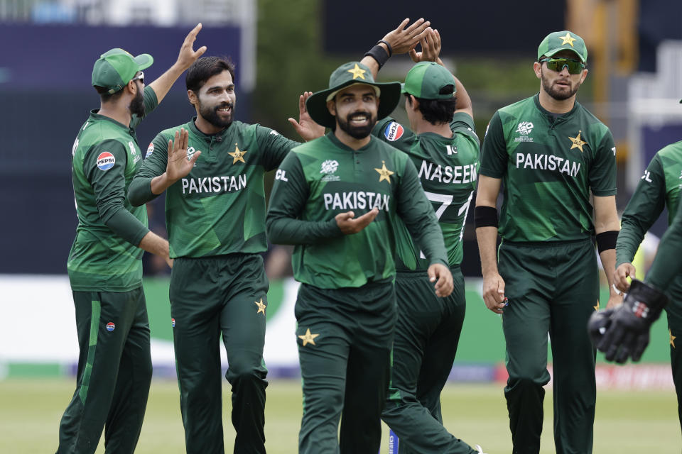 Pakistan's Mohammad Amir, second left, celebrates with teammates after the dismissal of Canada's captain Saad Bin Zafar during the ICC Men's T20 World Cup cricket match between Pakistan and Canada at the Nassau County International Cricket Stadium in Westbury, New York, Tuesday, June 11, 2024. (AP Photo/Adam Hunger)