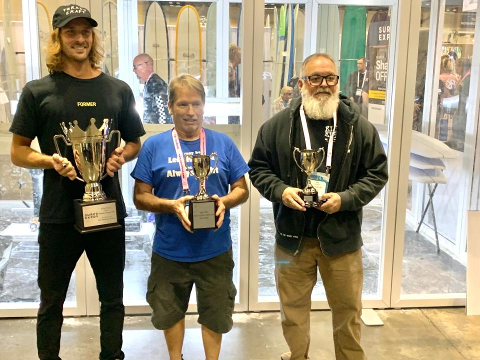 Josh Peterson, 27, of Oahu, Hawaii, left, claimed the top prize, $2,000, at the annual Surf Expo in Orlando in the annual Florida Shape-off, a shaping contest promoting the craft of hand-shaping surfboards. Jeff Haney, center, of Merritt Island took second, winning $1,000, and Jim Hannan, of Melbourne, earned $500 for third.