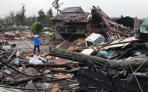 Damaged houses caused by Typhoon Hagibis are seen in Ichihara, Chiba  - Credit: Jiji Press/AFP