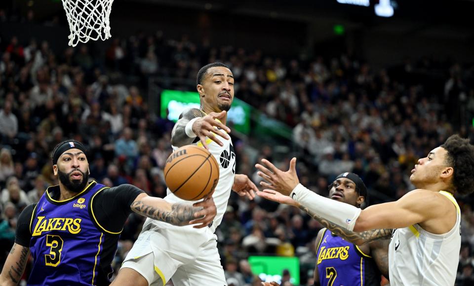 Utah Jazz forward John Collins (20) and Utah Jazz guard <a class="link " href="https://sports.yahoo.com/nba/players/10100" data-i13n="sec:content-canvas;subsec:anchor_text;elm:context_link" data-ylk="slk:Keyonte George;sec:content-canvas;subsec:anchor_text;elm:context_link;itc:0">Keyonte George</a> (3) battle Los Angeles Lakers forward Anthony Davis (3) for a rebound as Utah and Los Angeles play at the Delta Center in Salt Lake City on Saturday, Jan. 13, 2024. Utah won 132-125. | Scott G Winterton, Deseret News