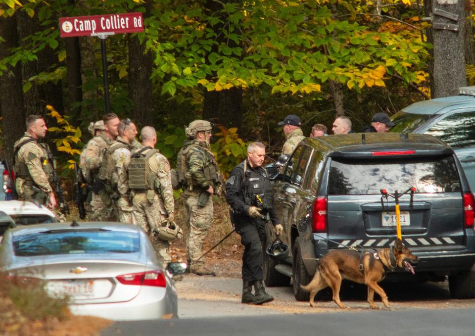 GARDNER - Mass. State Police troopers gather at the intersection of Kelton Street and Camp Collier Road as the search continues for Aaron M. Pennington Tuesday, October 24, 2023.