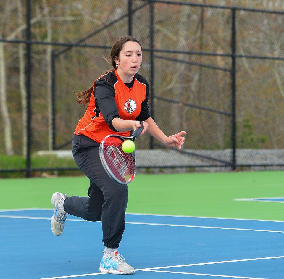 Diman’s Lindsey Moniz returns a serve during Wednesday’s match against Westport.