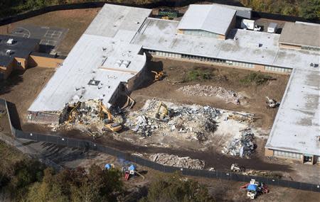 Demolition work is underway at Sandy Hook Elementary School in Newtown, Connecticut October 25, 2013. REUTERS/Michelle McLoughlin
