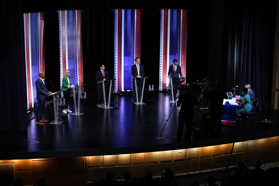 Mandela Barnes, left to right, Sarah Godlewski, Alex Lasry, Tom Nelson and Steven Olikara participate in a televised Wisconsin Democratic U.S. Senate debate, Sunday, July 17, 2022, in Milwaukee. (AP Photo/Morry Gash)