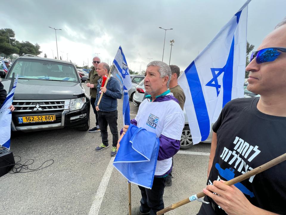 Ronen Keler, center, listens to a briefing ahead of a protest by reservists from Israel's in Jerusalem on April 20, 2023.