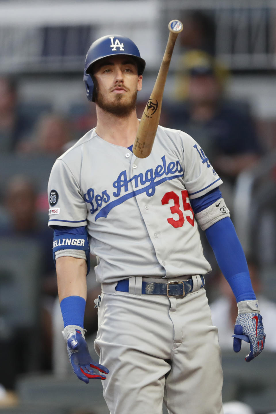 Los Angeles Dodgers' Cody Bellinger flips his bat after swinging and missing while batting in the second inning of a baseball game against the Atlanta Braves, Saturday, Aug. 17, 2019, in Atlanta. (AP Photo/John Bazemore)