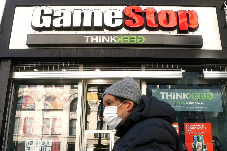 A person walks past a GameStop in the Manhattan borough of New York City, New York, U.S., January 29, 2021. REUTERS/Carlo Allegri