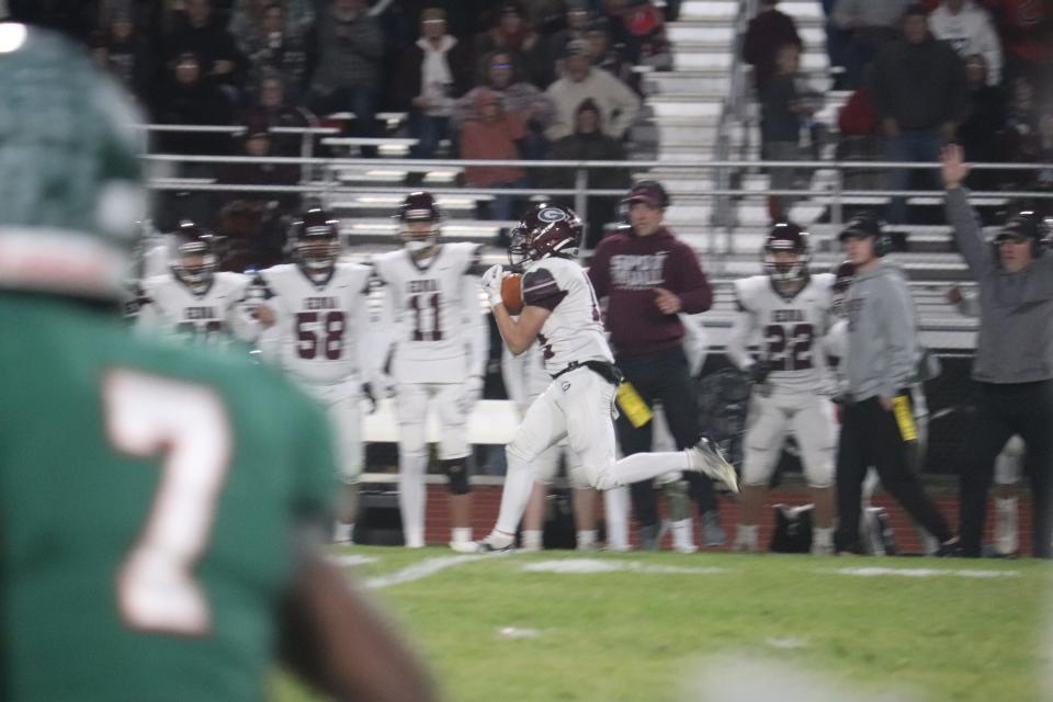 Genoa's Mason Drummond secures a touchdown pass from Aiden Brunkhorst.