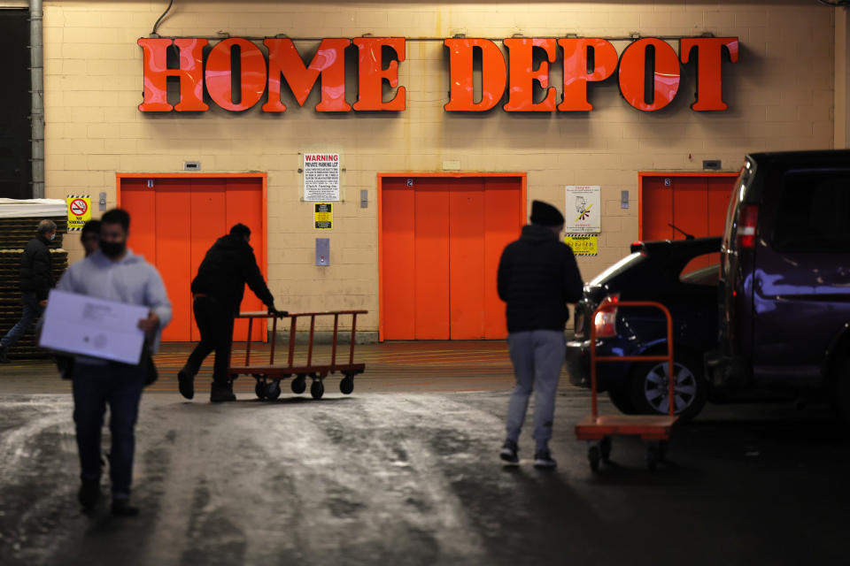 NEW YORK, NEW YORK - FEBRUARY 22: People walk through a Home Depot store parking lot on February 22, 2022 in the Sunset Park neighborhood of the Brooklyn borough in New York City. Home Depot announced on Tuesday that sales grew 11 percent in the fiscal fourth quarter. The company saw challenges of inflation and supply chain bottlenecks as demand decreased during the coronavirus (COVID-19) pandemic. Home Depot projects growth in 2022 with contractors buying lumber, electrical equipment and other supplies.  (Photo by Michael M. Santiago/Getty Images)