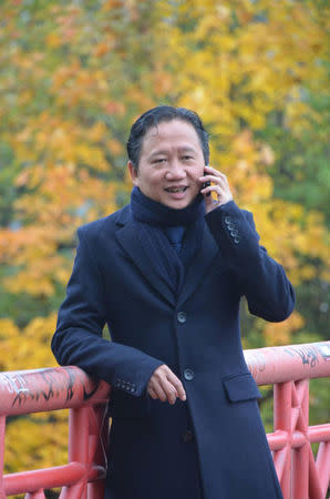 Trinh Xuan Thanh, former executive at a state oil company PetroVietnam, talks on phone at a park in Berlin, Germany October 20, 2016. Bui Thanh Hieu (Nguoi Buon Gio)/Handout via REUTERS