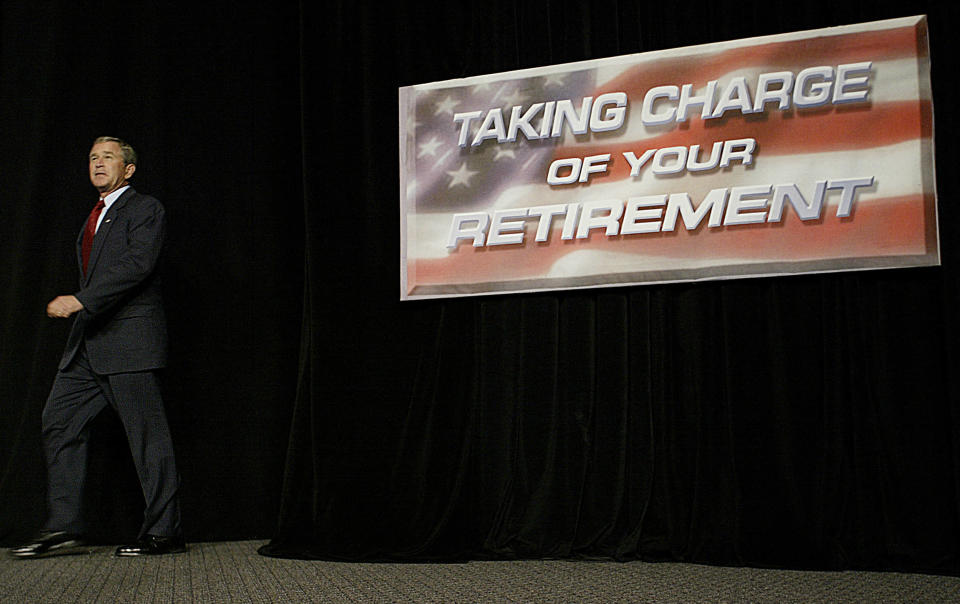 TOPSHOT - US President George W. Bush arrives to speak at a roundtable discusion on Social Security reform in Galveston, Texas, 26 April, 2005. Bush's popularity has reached its lowest point since August, with 64 percent of Americans disapproving his handling of Social Security and only 40 percent approving his work on the economy, according to the ABC News/Washington Post poll. (Photo by JIM WATSON / AFP) (Photo by JIM WATSON/AFP via Getty Images)