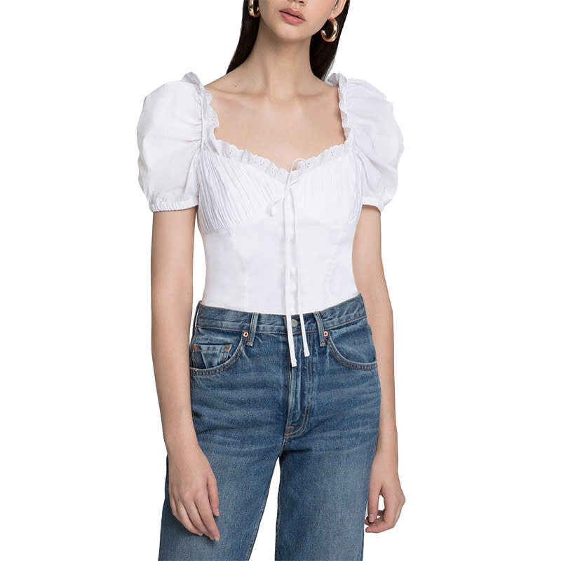 <a rel="nofollow noopener" href="http://www.anrdoezrs.net/links/3550561/type/dlg/https://www.pixiemarket.com/collections/whats-new/products/bella-white-frill-bustier-top" target="_blank" data-ylk="slk:Bella White Frill Bustier Top, Pixie Market, $105Romantic detailing like this bustier-style top with puffed shoulders is feminine and flattering on every body type.;elm:context_link;itc:0;sec:content-canvas" class="link ">Bella White Frill Bustier Top, Pixie Market, $105<p>Romantic detailing like this bustier-style top with puffed shoulders is feminine and flattering on every body type.</p> </a>