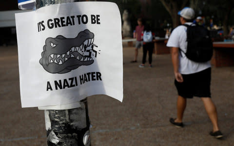 A flier is seen from a pole the day before a speech by Richard Spencer in Florida - Credit: Reuters