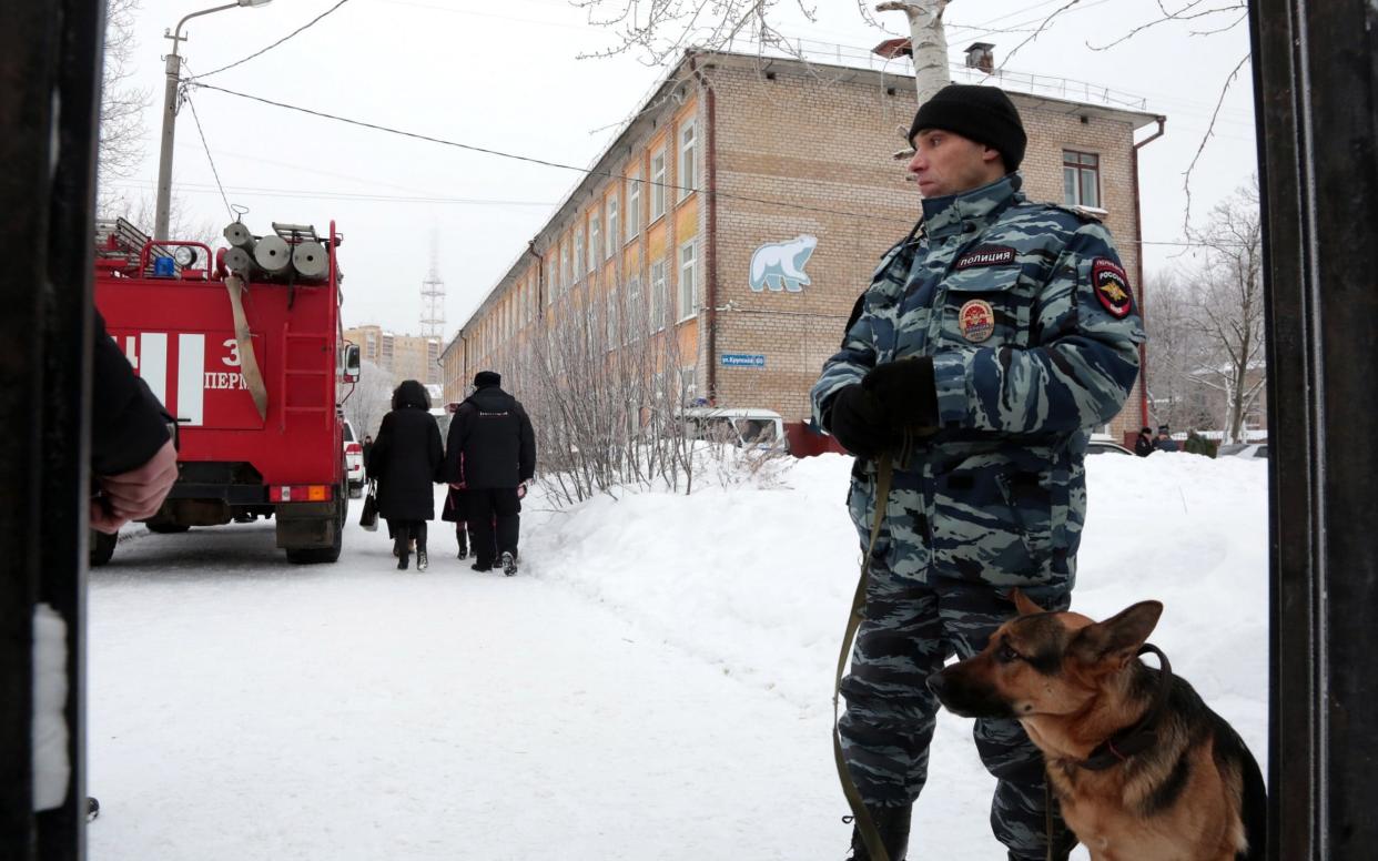 Police and a fire engine respond to the knife attack at school number 127 in Perm - TASS