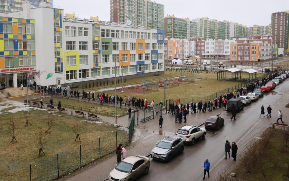 Voters queue at a polling station in St Petersburg