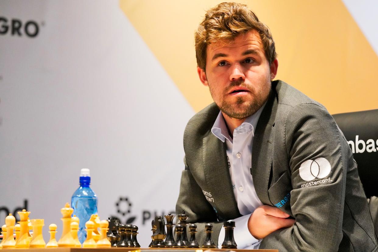 Magnus Carlsen of Norway competes during the FIDE World Championship at Dubai Expo 2020 in Dubai, United Arab Emirates, Friday, Dec. 10, 2021.