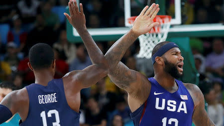 Demarcus Cousins (USA) of the USA and Paul George (USA) of the USA. REUTERS/Jim Young FOR