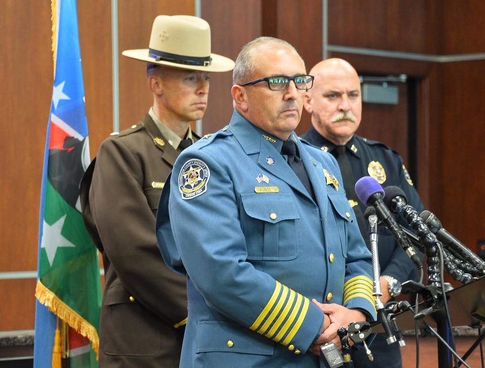 Flanked by Lt. Col. Dan Pickett of the Maryland State Police and Capt. Tom Langston of the Hagerstown Police Department, Washington County Sheriff Brian K. Albert speaks to journalists Thursday after the body of fugitive Pedro M. Argote was discovered near Williamsport.