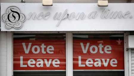 FILE PHOTO: Vote leave signs are seen in the window of a shop in Hale northern England, June 7, 2016. REUTERS/Phil Noble/File Photo