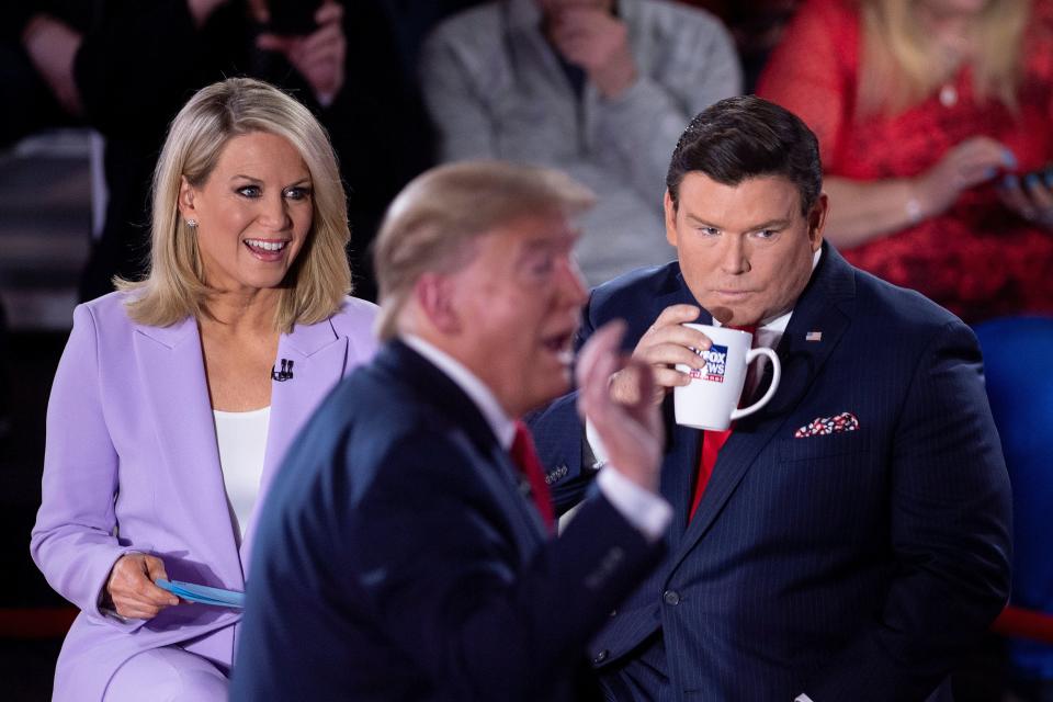 Fox News anchors Martha MacCallum and Bret Baier, pictured in March with Donald Trump, have been asked to quarantine, according to a New York Times report. (BRENDAN SMIALOWSKI via Getty Images)