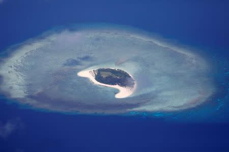 FILE PHOTO: An aerial view of uninhabited island of Spratlys in the disputed South China Sea, April 21, 2017. REUTERS/Erik De Castro