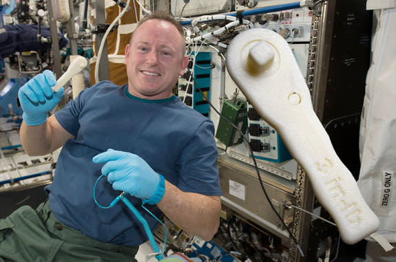 International Space Station commander Butch Wilmore shows off the ratchet wrench made with Made In Space's 3D printer on the station. The same wrench can now be printed at home.