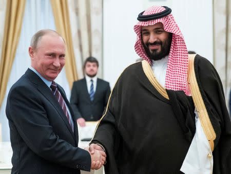 FILE PHOTO: Russian President Vladimir Putin shakes hands with Saudi Deputy Crown Prince and Defence Minister Mohammed bin Salman during a meeting at the Kremlin in Moscow, Russia, May 30, 2017. REUTERS/Pavel Golovkin/Pool/File Photo