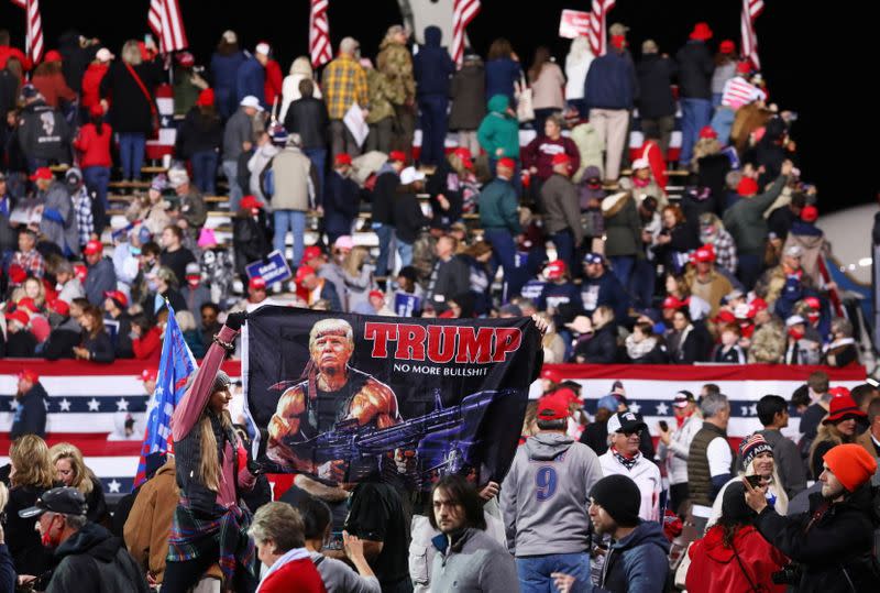 A flag is held up after U.S. President Donald Trump spoke at a campaign event with U.S. Republican Senators David Perdue and Kelly Loeffler at Valdosta Regional Airport in Valdosta