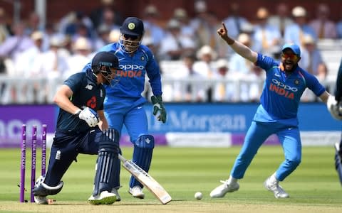  MS Dhoni and Suresh Raina of India celebrate as Jonathan Bairstow of England is bowled by Kuldeep Yadav during the 2nd ODI Royal London One-Day match between England and India  - Credit:  Gareth Copley/Getty Images