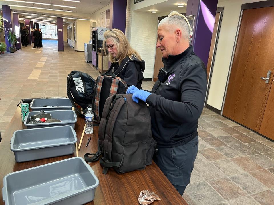 The East Stroudsburg Area security team search bags as students walk through metal detectors at the South high school on the morning of March 30,2023.