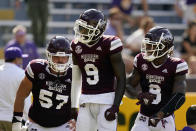 Mississippi State wide receiver Tyrell Shavers (9) celebrates his touchdown reception with running back Kylin Hill (8) and offensive lineman Cole Smith (57) in the first half an NCAA college football game against LSU in Baton Rouge, La., Saturday, Sept. 26, 2020. (AP Photo/Gerald Herbert)