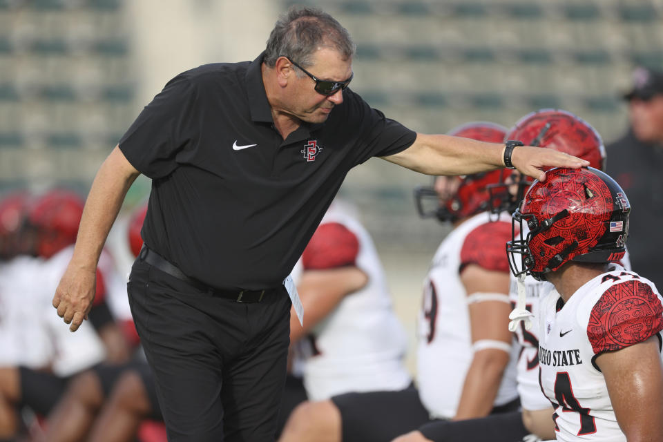 San Diego State head coach Brady Hoke reacts with his team before an NCAA college football game against Hawaii, Saturday, Oct. 14, 2023, in Honolulu. (AP Photo/Marco Garcia)