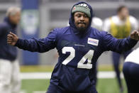 Seattle Seahawks running back Marshawn Lynch warms up at the NFL football team's practice facility Tuesday, Dec. 24, 2019, in Renton, Wash. When Lynch played his last game for the Seahawks in 2016, the idea of him ever wearing a Seahawks uniform again seemed preposterous. Yet, here are the Seahawks getting ready to have Lynch potentially play a major role Sunday against San Francisco with the NFC West title on the line. (AP Photo/Elaine Thompson)